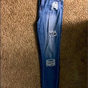 Distressed medium wash skinny jeans